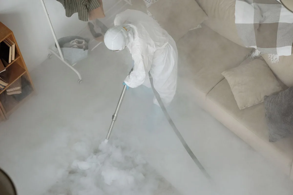 Biohazard cleanup technician in protective equipment, Cornersville, TN